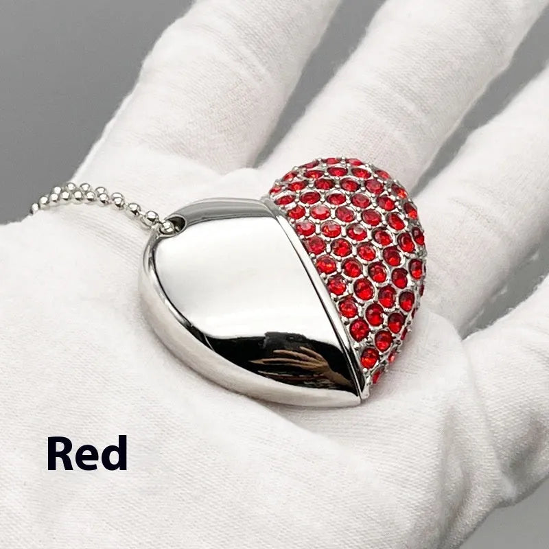Brick-inlaid heart-shaped metal USB flash drive in multiple colours on a white background.