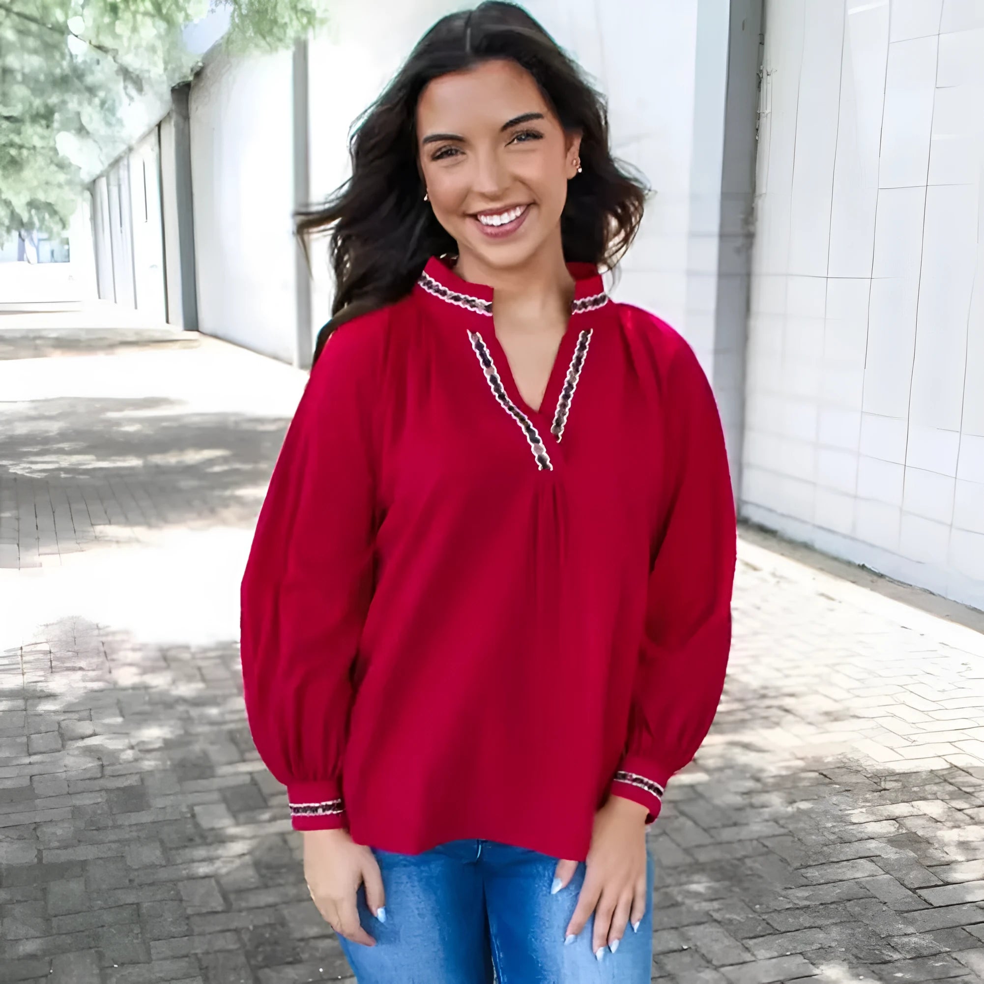 Women's red polyester pullover shirt with embroidered collar and printed design, loose fit