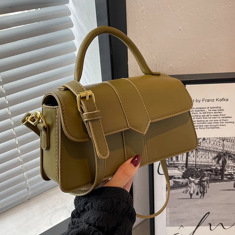 Women's beige PU messenger bag with sandwich pocket and file organiser interior.