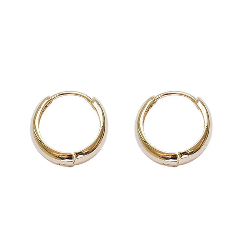 Women's minimalist geometric water drop earrings in gold or silver on a copper base, shown in large, medium, and small sizes.