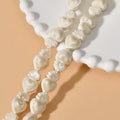 Small heart-shaped ceramic beads in multiple colours showing straight hole, approximately 10mm by 15mm size