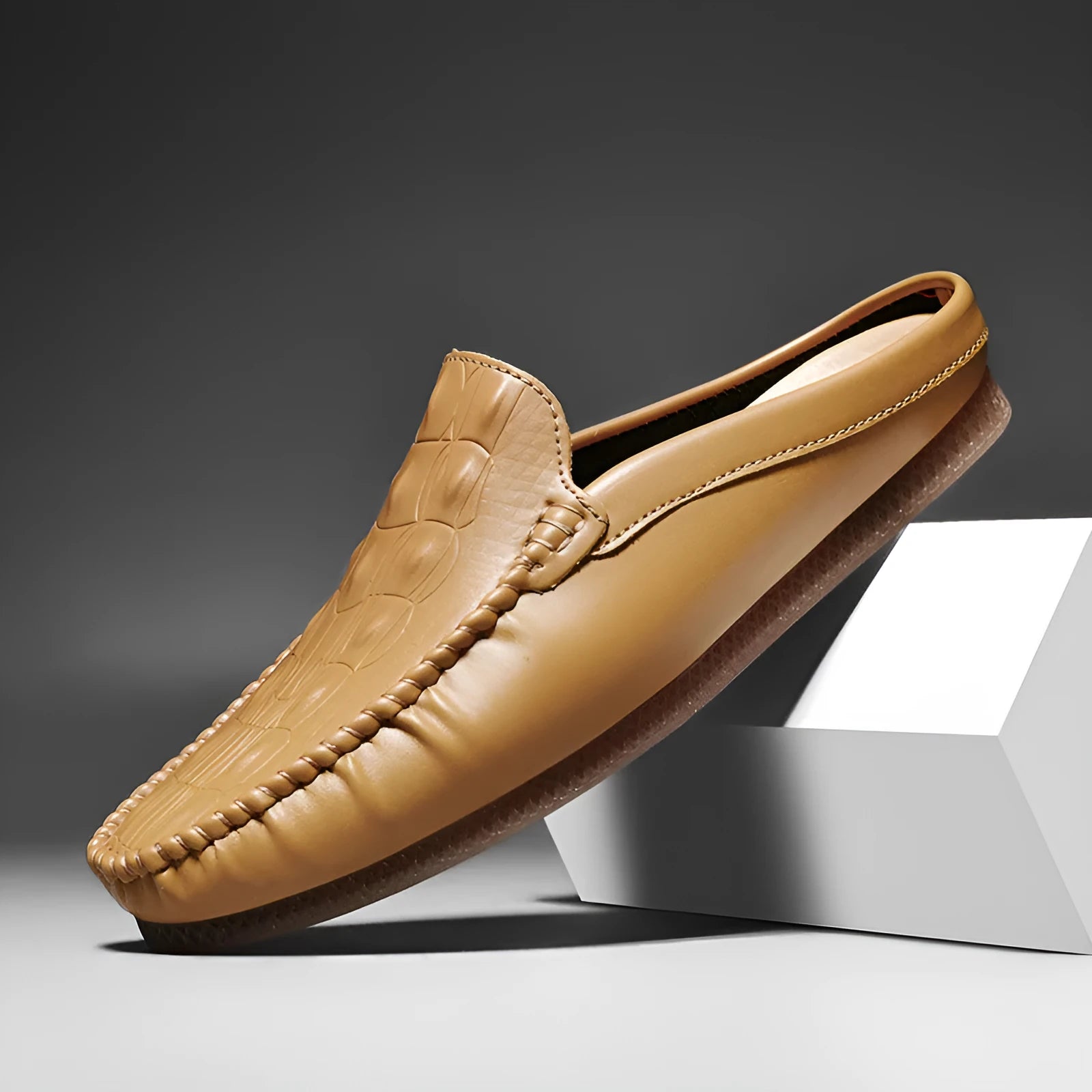 Men's black Gommino-style leisure semi-slippers with artificial PU upper and rubber sole on a white background.