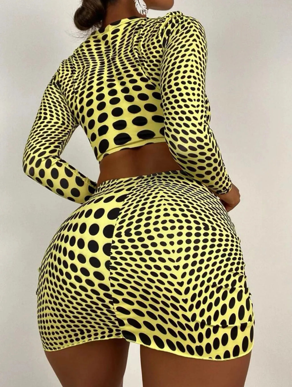 Green and yellow polka dot women's swimsuit three-piece set showing top, skirt, and bra