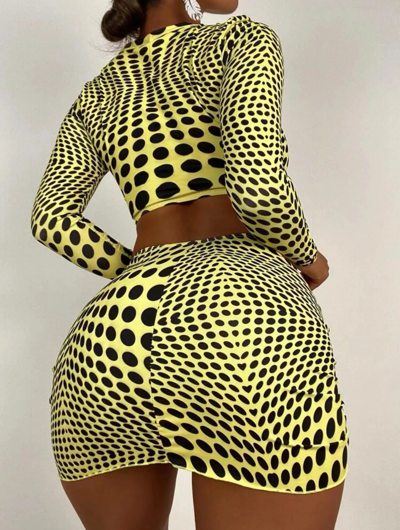 Green and yellow polka dot women's swimsuit three-piece set showing top, skirt, and bra