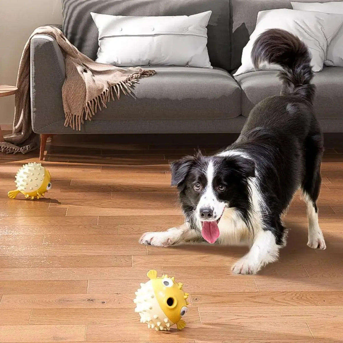 Yellow fish-shaped durable vinyl dog chew toy with textured surface and squeaker.