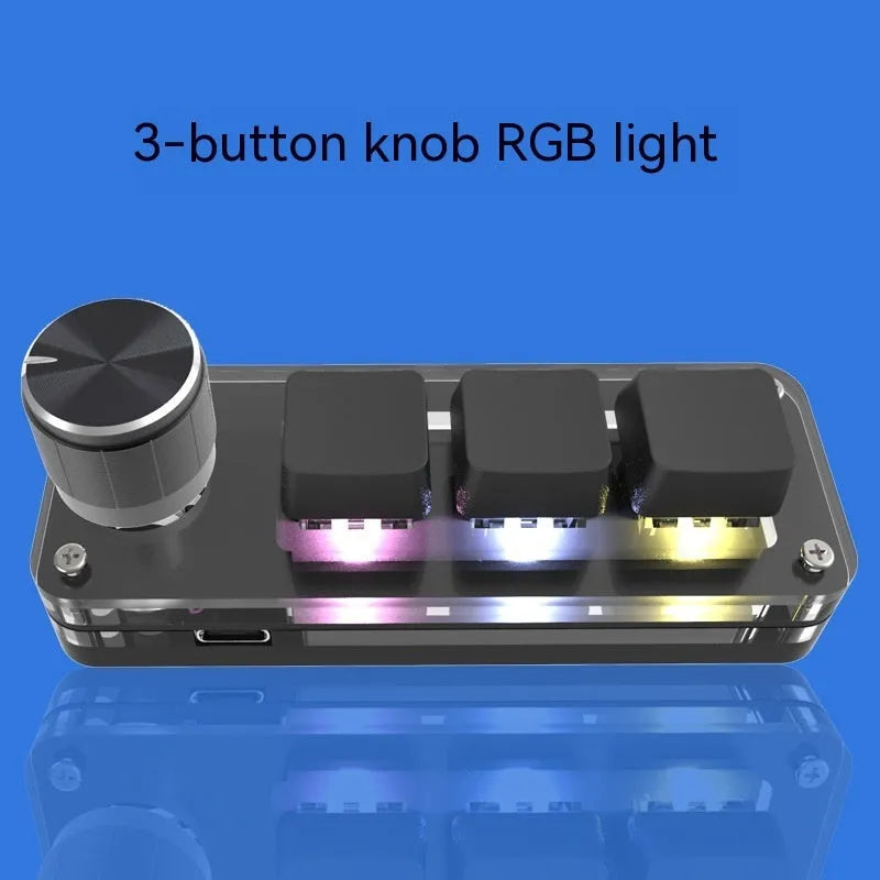Black and white RGB backlit keypad keyboard with USB cable on desk