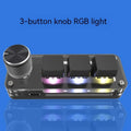Black and white RGB backlit keypad keyboard with USB cable on desk