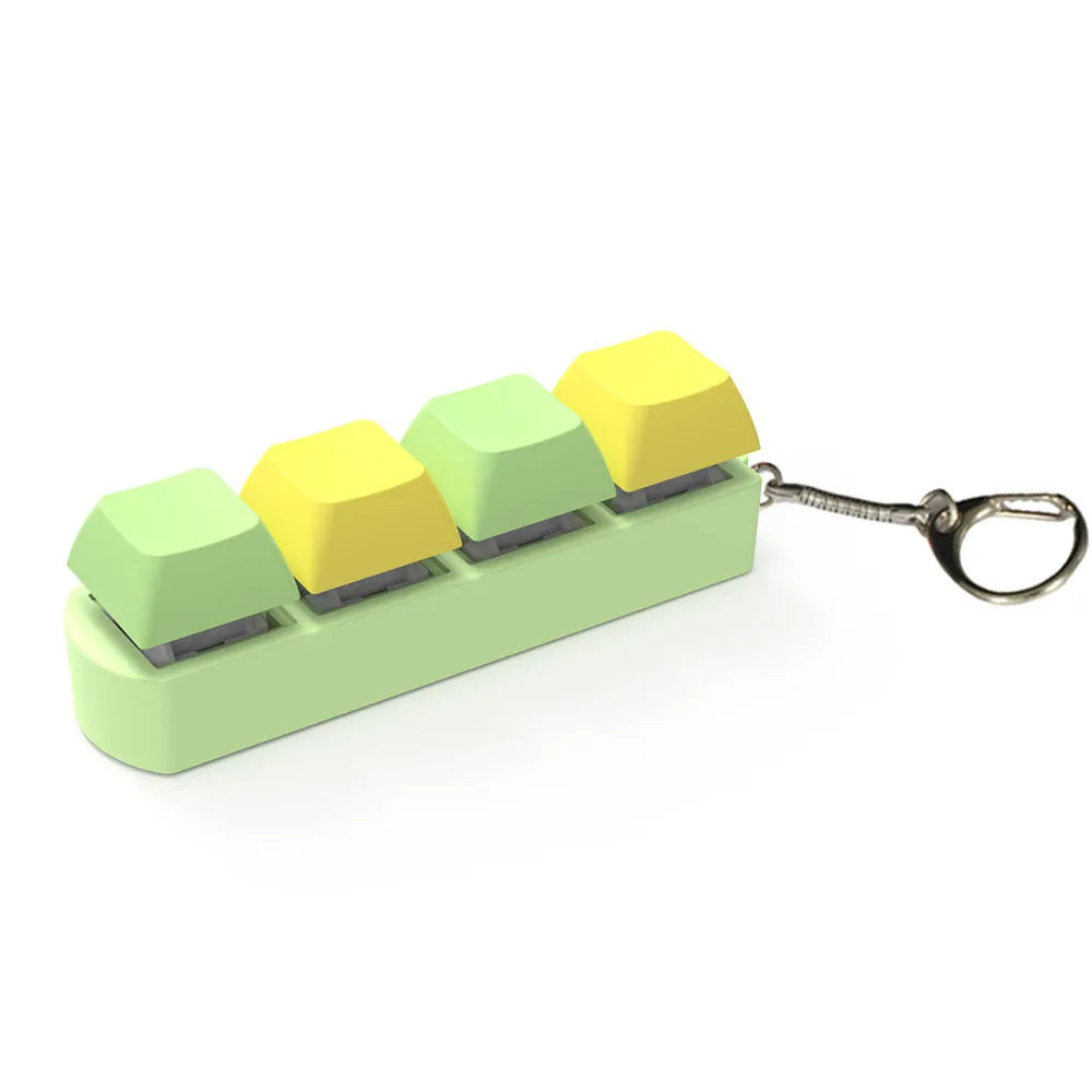 Four-key mechanical keyboard switch shaft tester with coloured keycaps and transparent base on a desk.