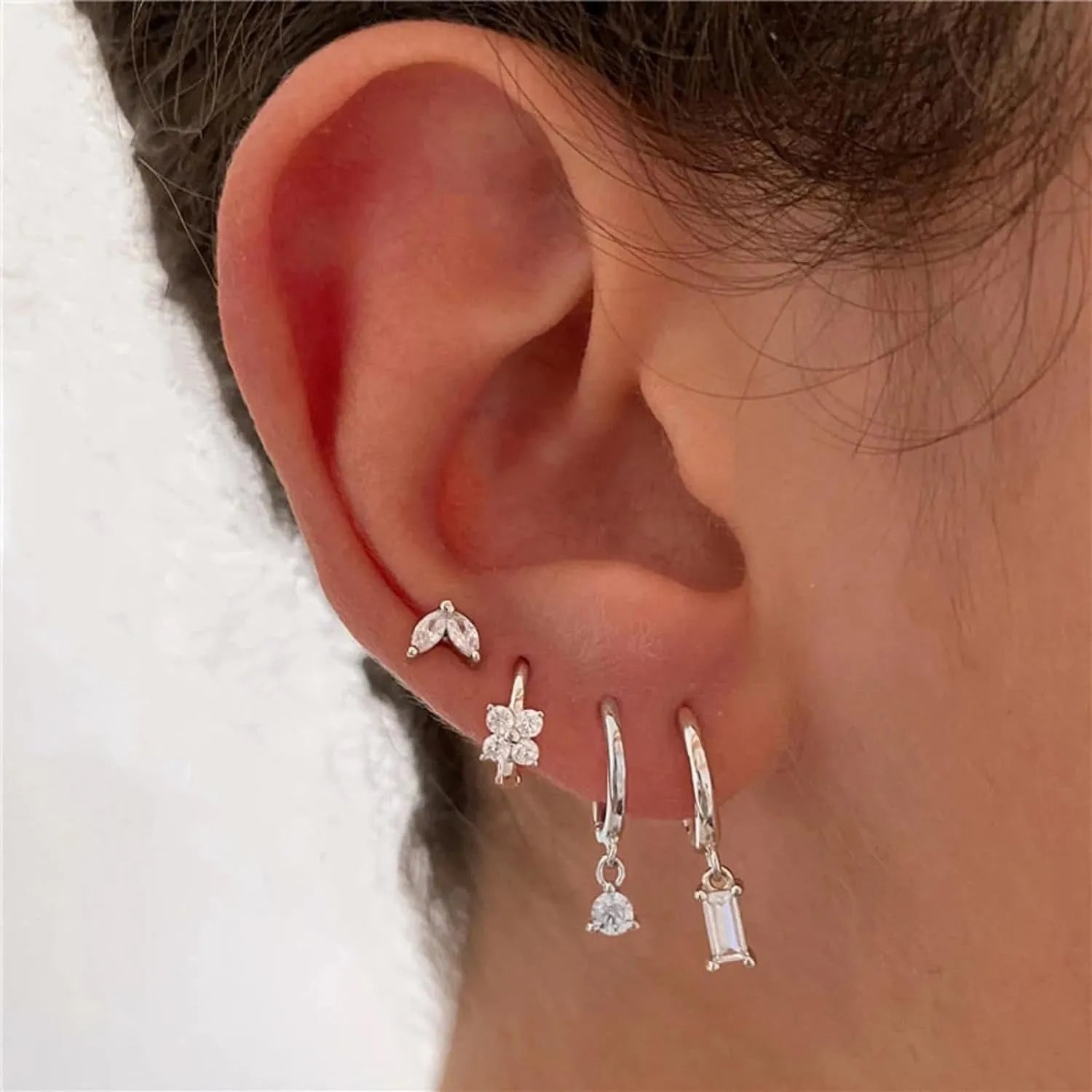 Geometric zircon earrings set for women with gold electroplated finish showing star and square designs