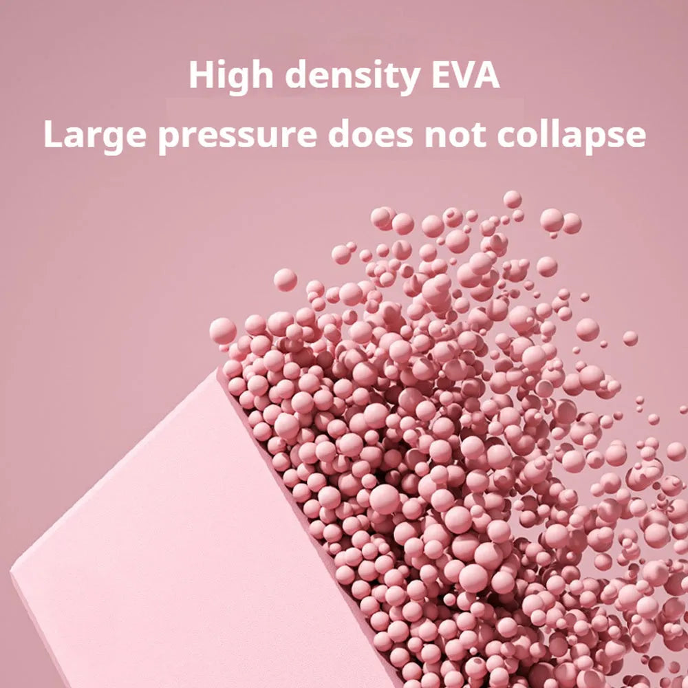 Solid colour EVA foam yoga block on a gym mat, showing its rectangular shape and ridged sides.