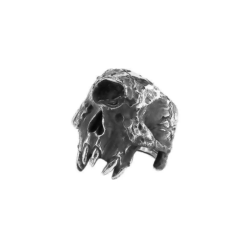 Silver-coloured alloy ring with a detailed one-eyed skull design on a finger.