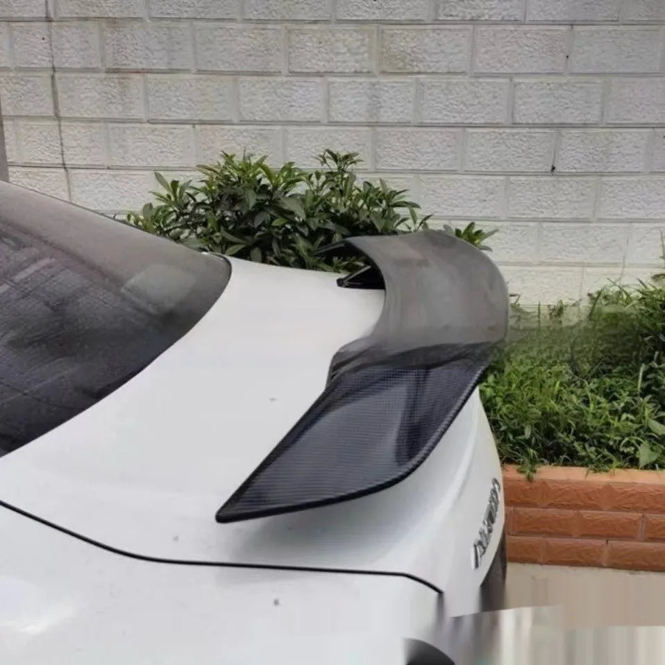 Universal punch-free fixed tail car spoiler in ABS plastic, shown in multiple finish options.