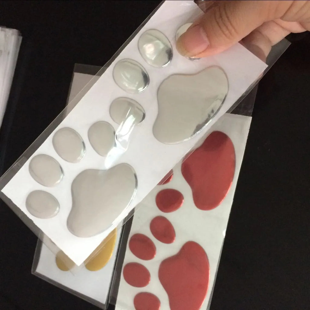 PVC car sticker with hand-shaped brush dog footprints pattern in silver colour, 7cm long.