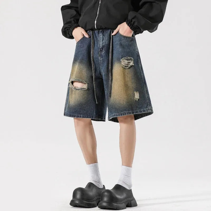 Men's distressed loose fit jeans in retro blue cotton denim with ripped detailing