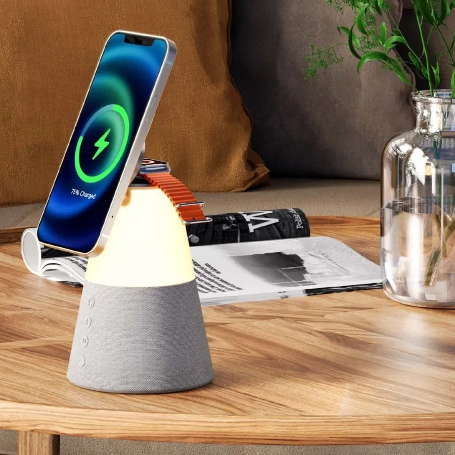 Gray 3-in-1 magnetic wireless charging Bluetooth speaker night light on a wooden table
