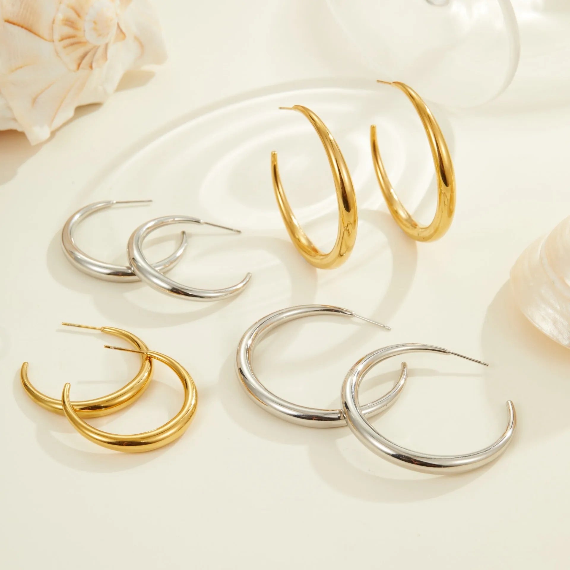 Titanium steel hoop earrings with 18K gold plating in large and small sizes