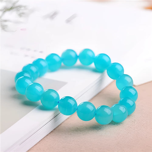 Grade 7A Amazonite natural stone scattered beads arranged on a bracelet, showing blue-green colour and polished finish.