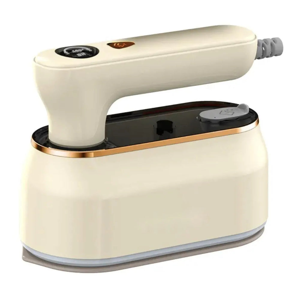 Milky white foldable portable steam iron with ceramic soleplate and international plug adaptors.