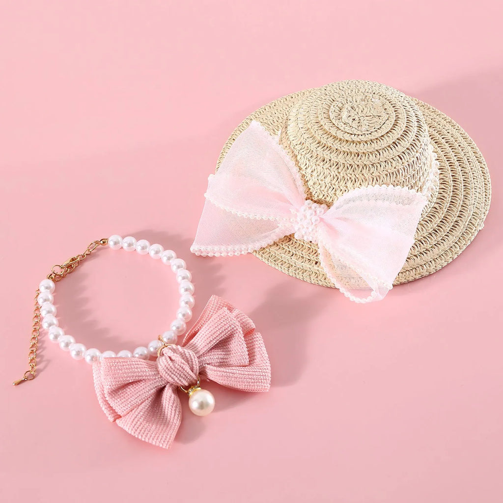 Woven straw pet hat with pearl bow decoration in pink, purple, blue or white colour options