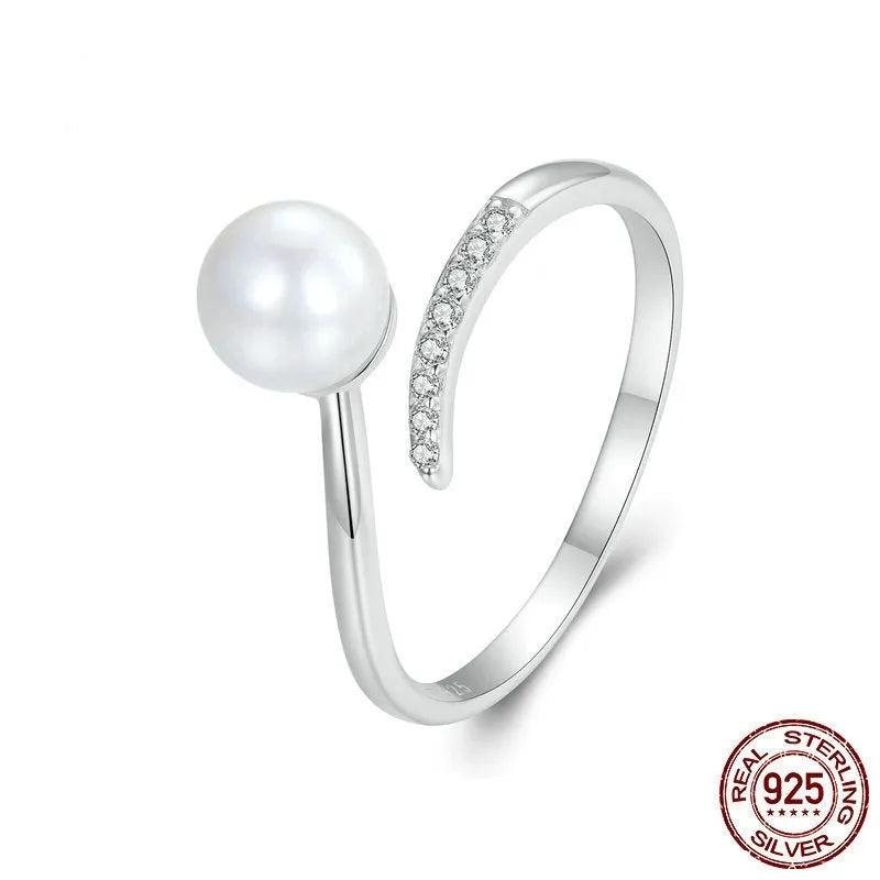 S925 sterling silver adjustable ring with natural shell pearl centrepiece showing open loop design