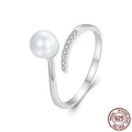 S925 sterling silver adjustable ring with natural shell pearl centrepiece showing open loop design