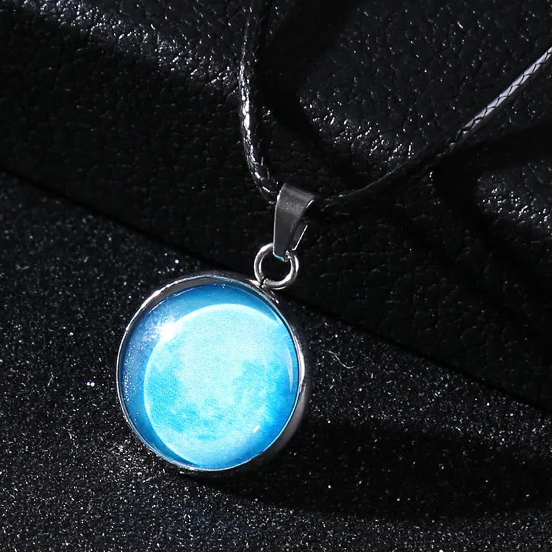 Luminous alloy necklace with a glass pendant depicting a Christmas moon night sky, showing the extension chain.