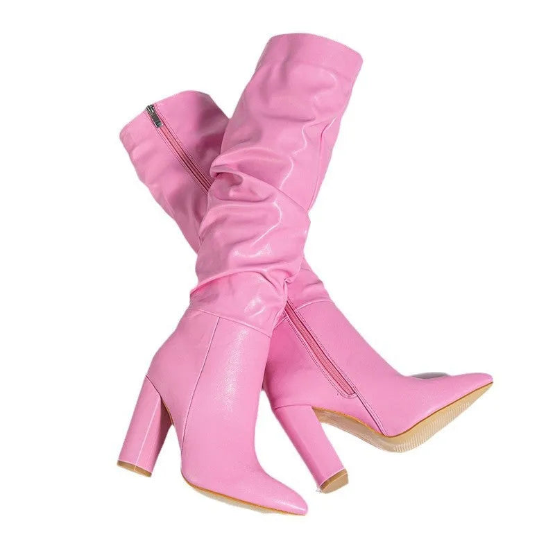 Women's white and pink pointed toe high heel boots with side zipper and mesh lining.