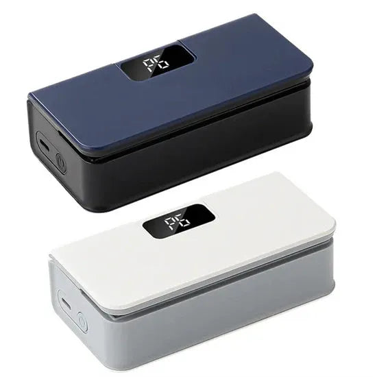 Small white handheld heat sealing machine for plastic food bags on a kitchen worktop.