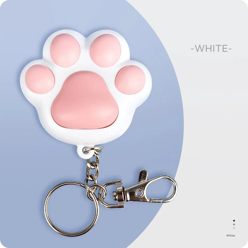 Pink and black infrared cat teaser key chain toy measuring 5cm by 2.5cm with USB charging port