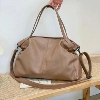 Large soft white PU messenger bag with a long cross-body shoulder strap and zip closure