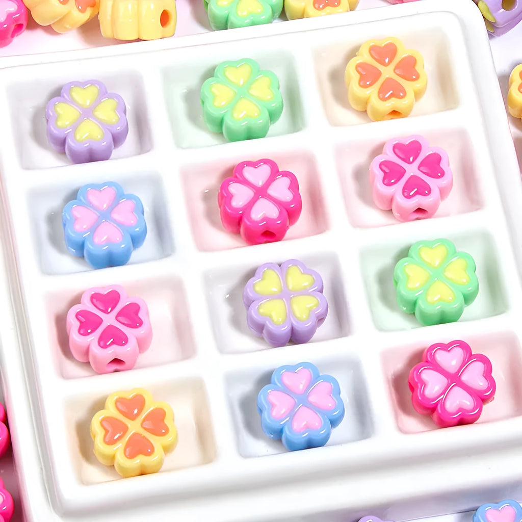 15mm acrylic four-leaf clove beads in light colours including rose red, pink, yellow, green, blue, and purple with frosted finish