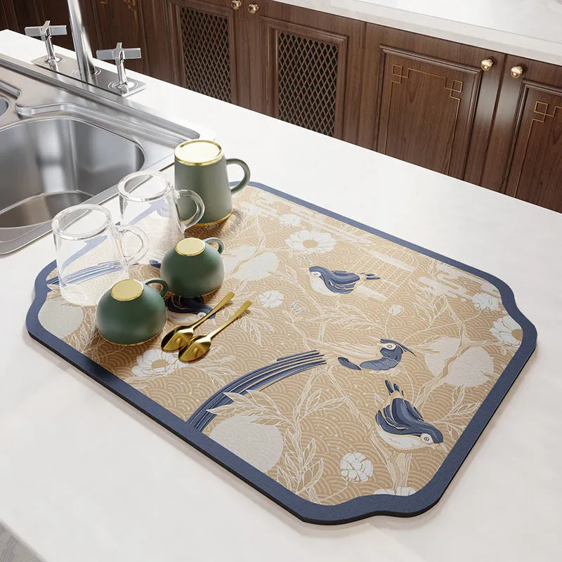 Square diatomite PVC kitchen draining mat in Camellia purple on a countertop