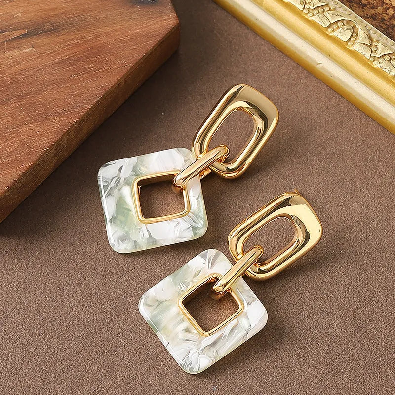 Copper geometric square earrings with hollow construction and chamfered pattern