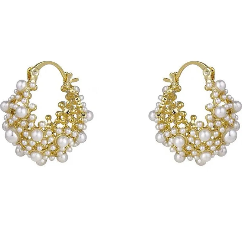 Gold-coloured copper flower basket earrings with small pearl-inlaid beads.