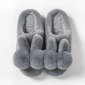Women's high-top bunny fluffy slippers in pink with rabbit fur and flower details.