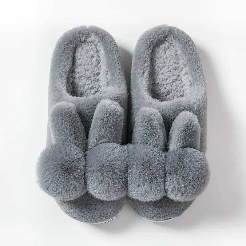 Women's high-top bunny fluffy slippers in pink with rabbit fur and flower details.