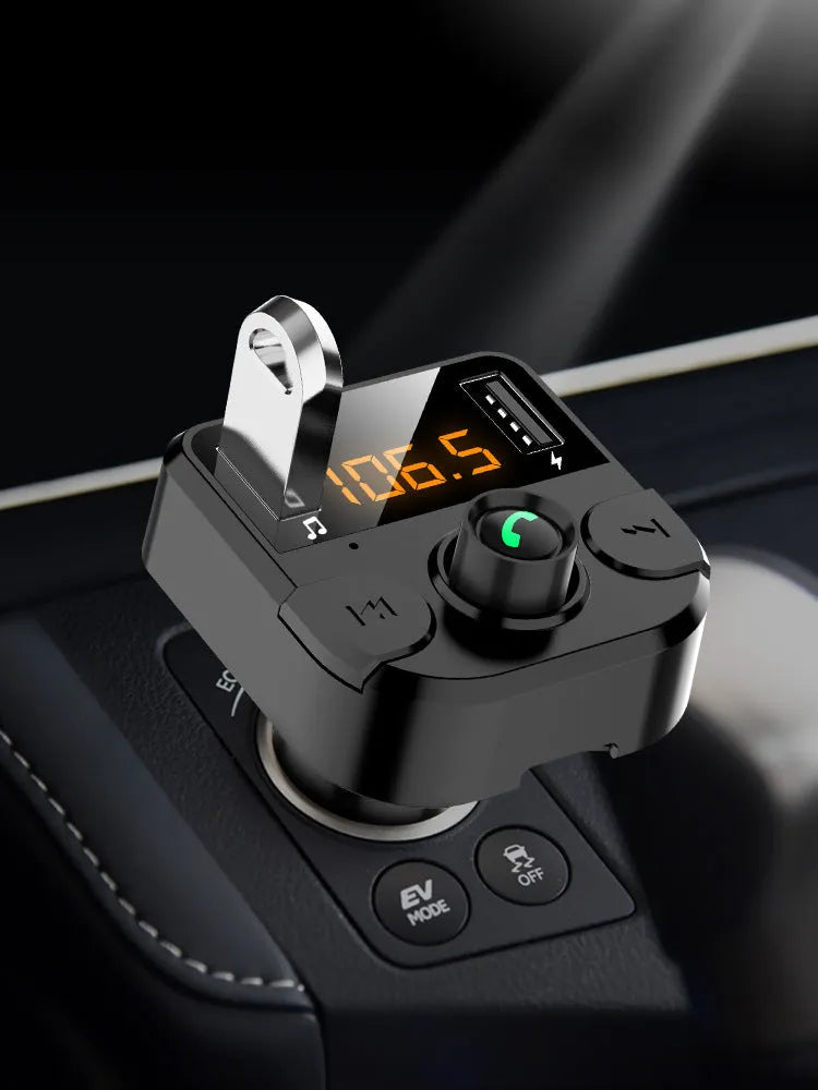 Black BT36B car Bluetooth MP3 player with FM transmitter plugged into a car cigarette lighter socket.