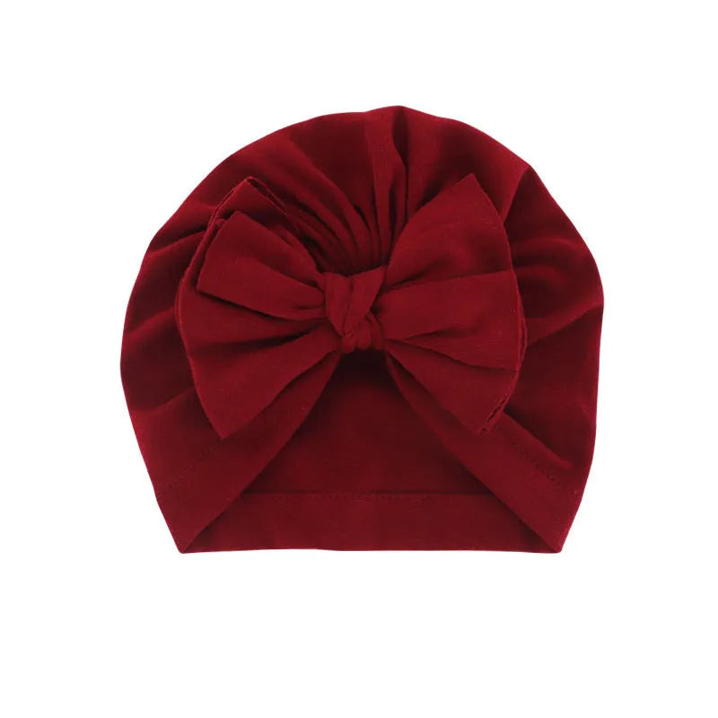 Baby hooded hat with bowknot wrapped turban in solid colour soft cloth polyester blend for 0-1 years old