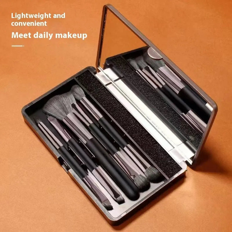 Makeup brush set with mirror showing eyeshadow brushes with artificial fibre bristles