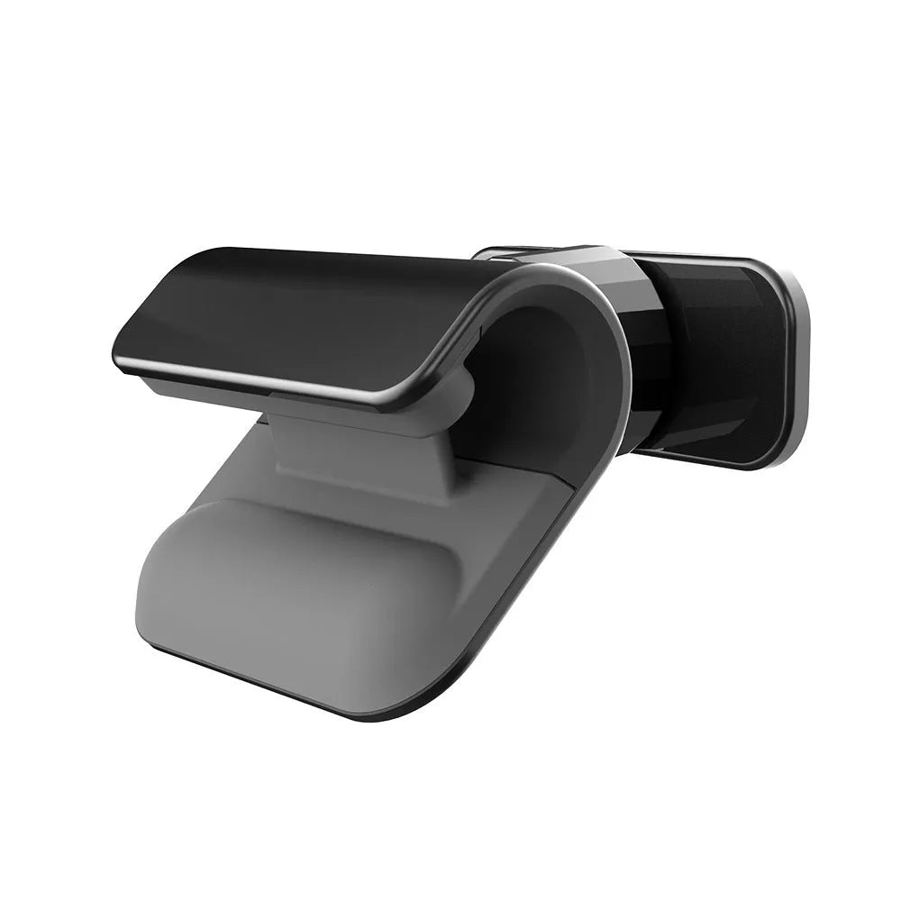 Black universal car phone holder with 360-degree rotation on a car dashboard.