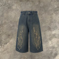Men's black denim shorts with cropped patch flame embroidery design and straight-leg fit