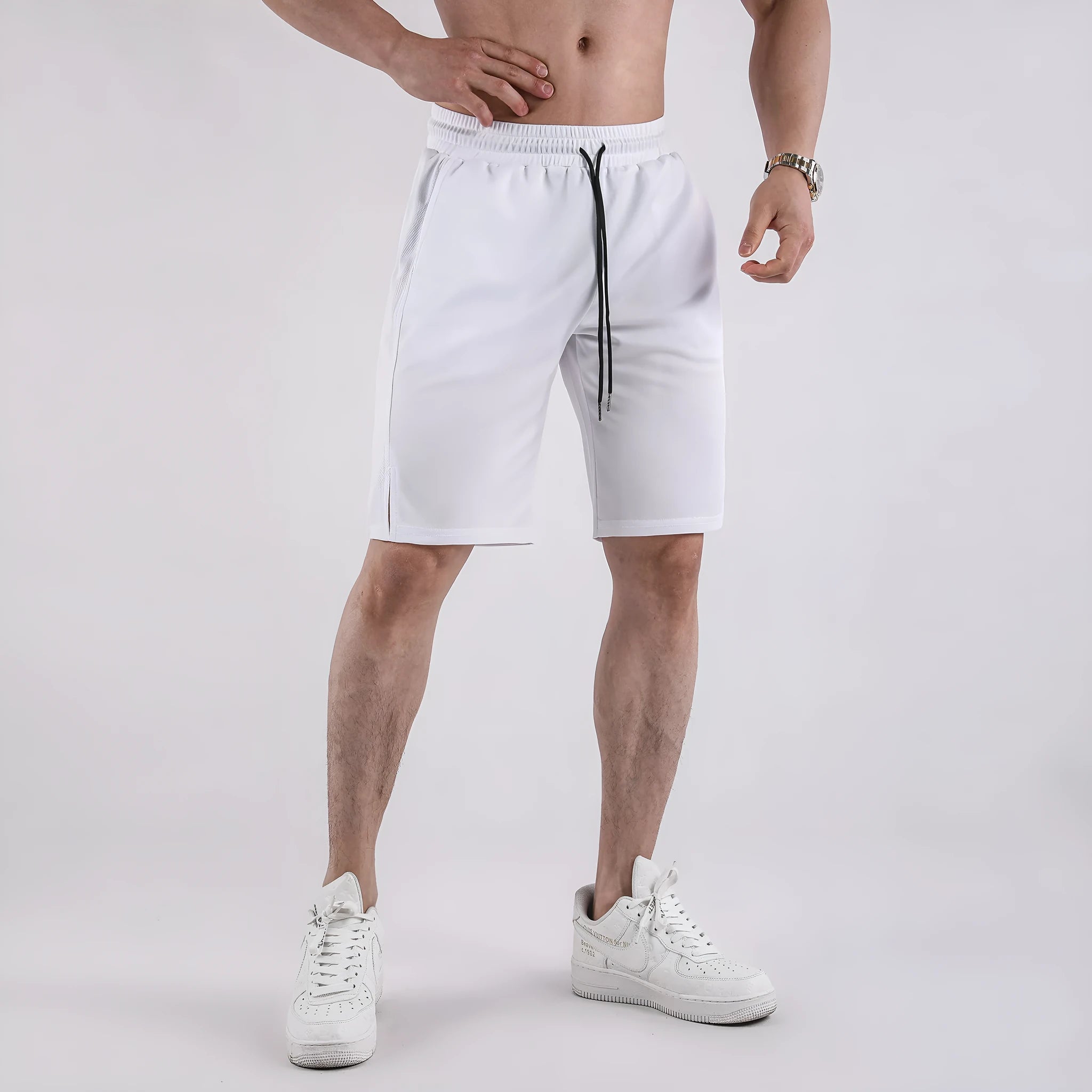 Men's black quick-drying mesh shorts with elastic waistband, shown in a loose casual fit.