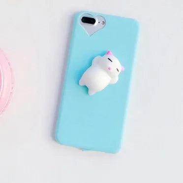 Soft pink silicone iPhone case with a raised 3D cartoon cat design on the back.