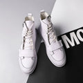 Men's black PU leather high-top ankle boot on a white background