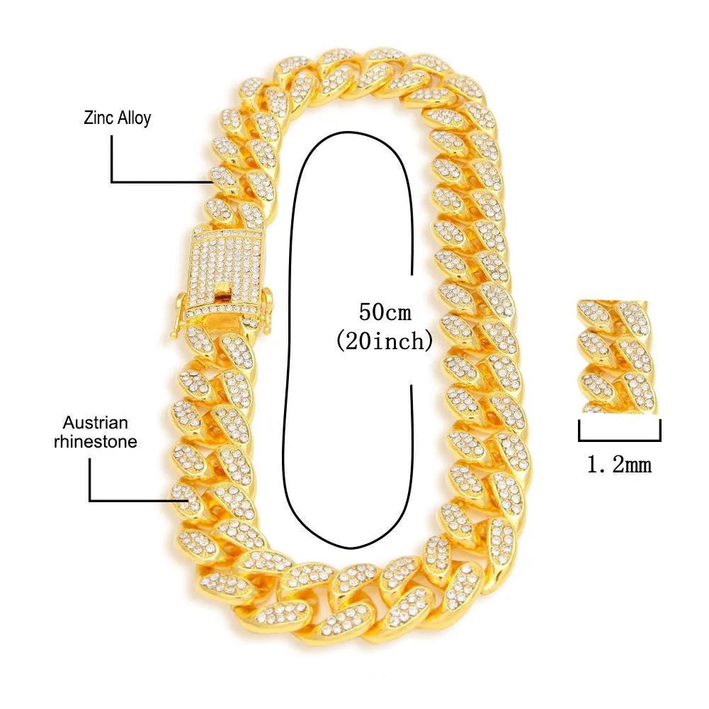 Gold Roman numeral quartz watch with diamond studs on a black mesh band, alongside a matching bracelet and necklace.