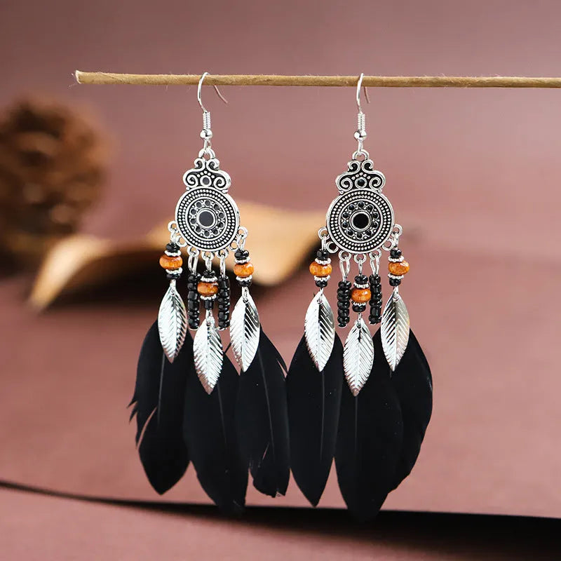 Round drop feather earrings with leaf pattern in alloy metal, available in multiple colours