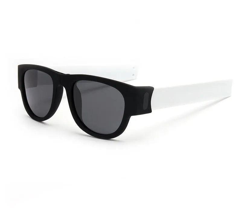 Folding bracelet sunglasses with polarized UV400 resin lens on wrist, black colour