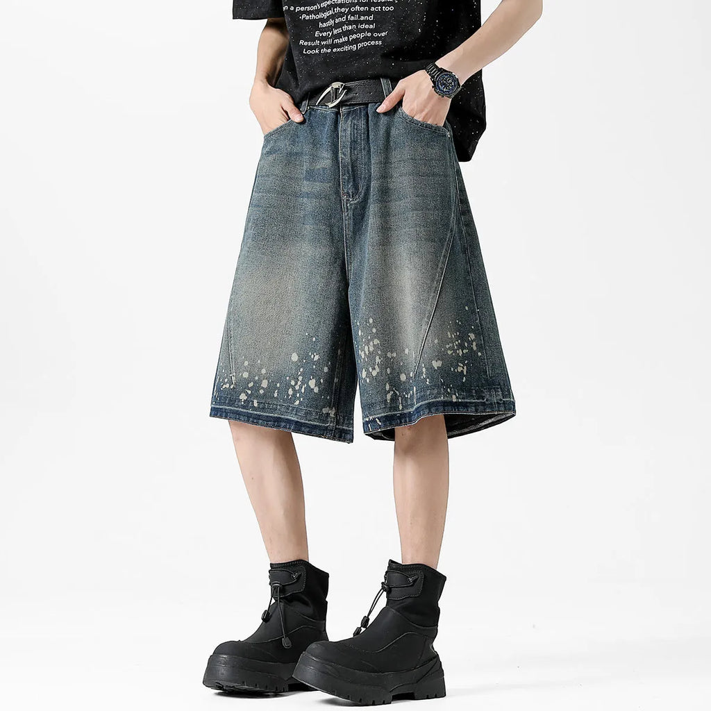 Men's retro blue denim shorts with washed finish and ripped knee detailing, straight leg cut