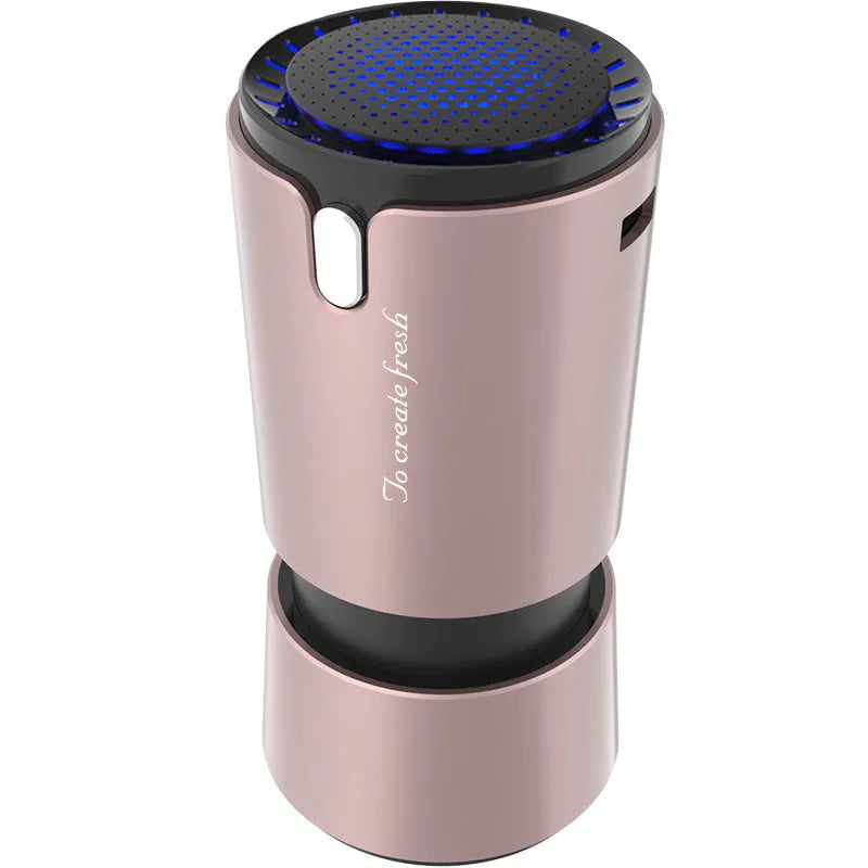 Portable mini car air purifier with True HEPA filter, USB cable, compact silver cup shape on car cup holder