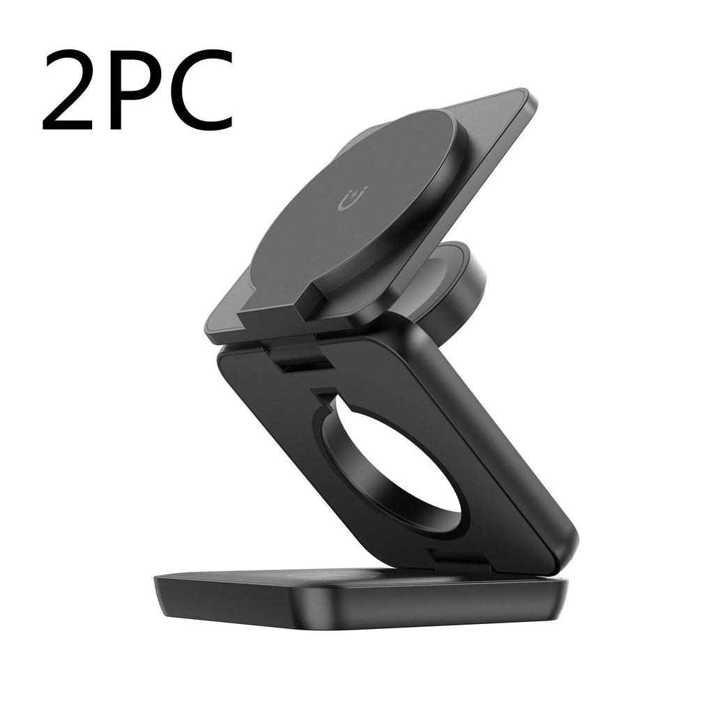 White foldable magnetic wireless phone charger holder in open position on a desk